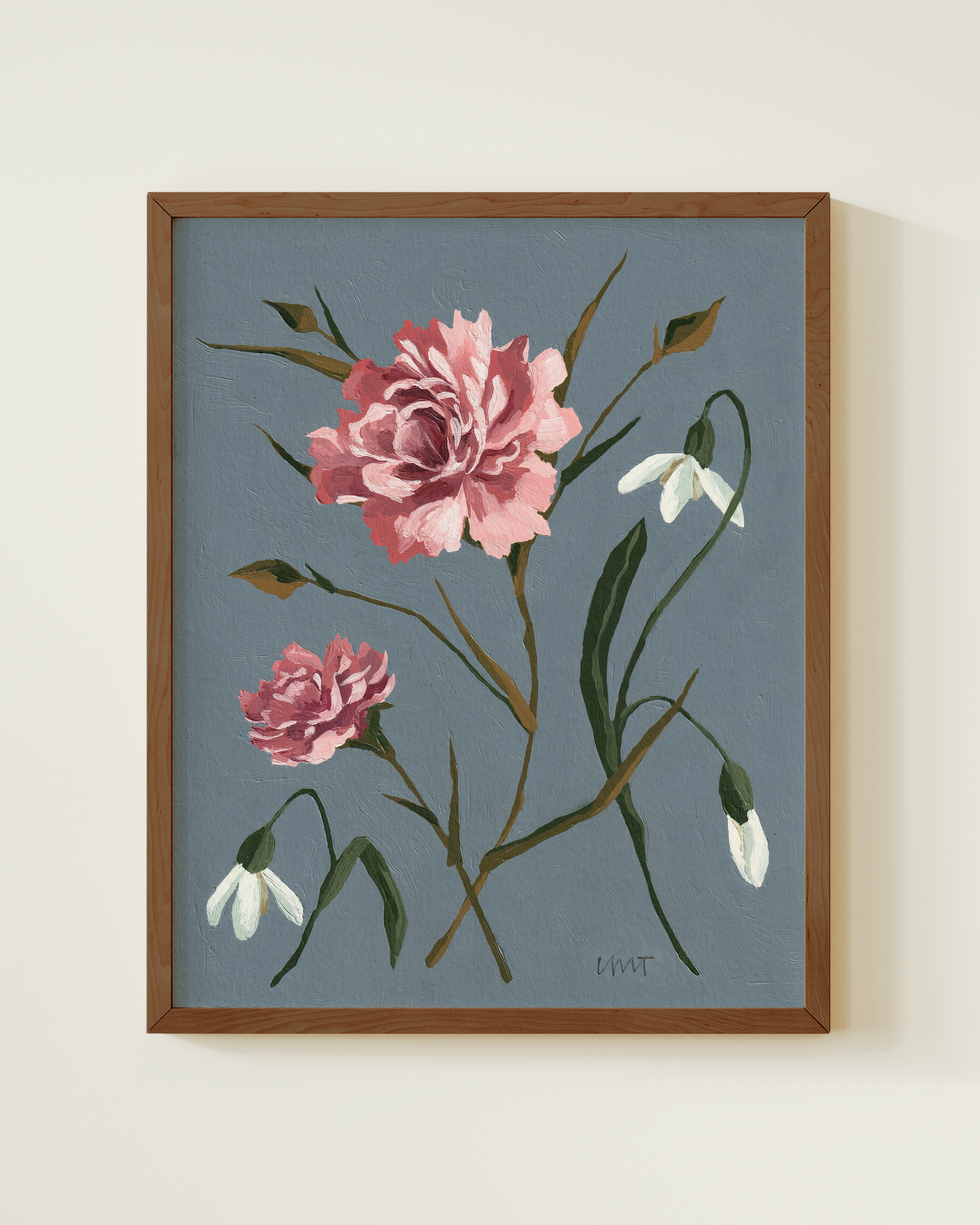 Framed artwork of pink flowers on a blue background