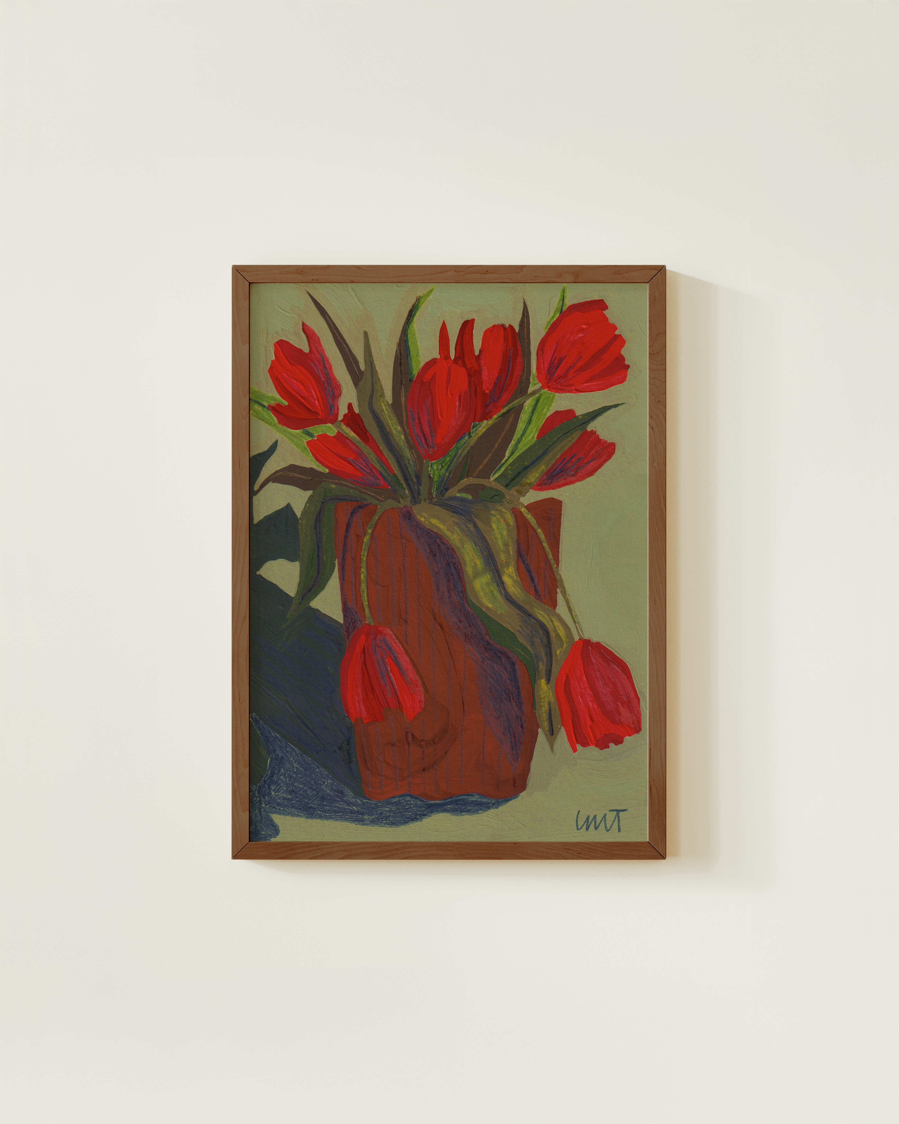 Painting of red tulips framed on a wall